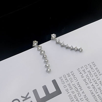 Örhänge med sju stjärnor och diamanter